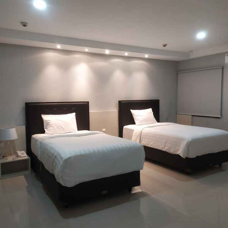 Double Kasur Di Kamar Deluxe